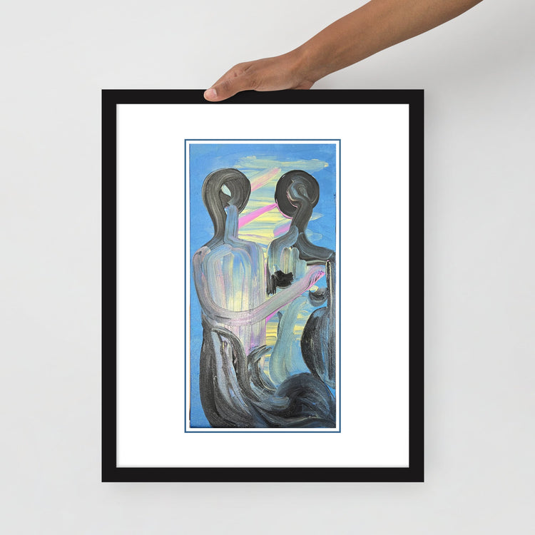Hand holding the framed print — close-up