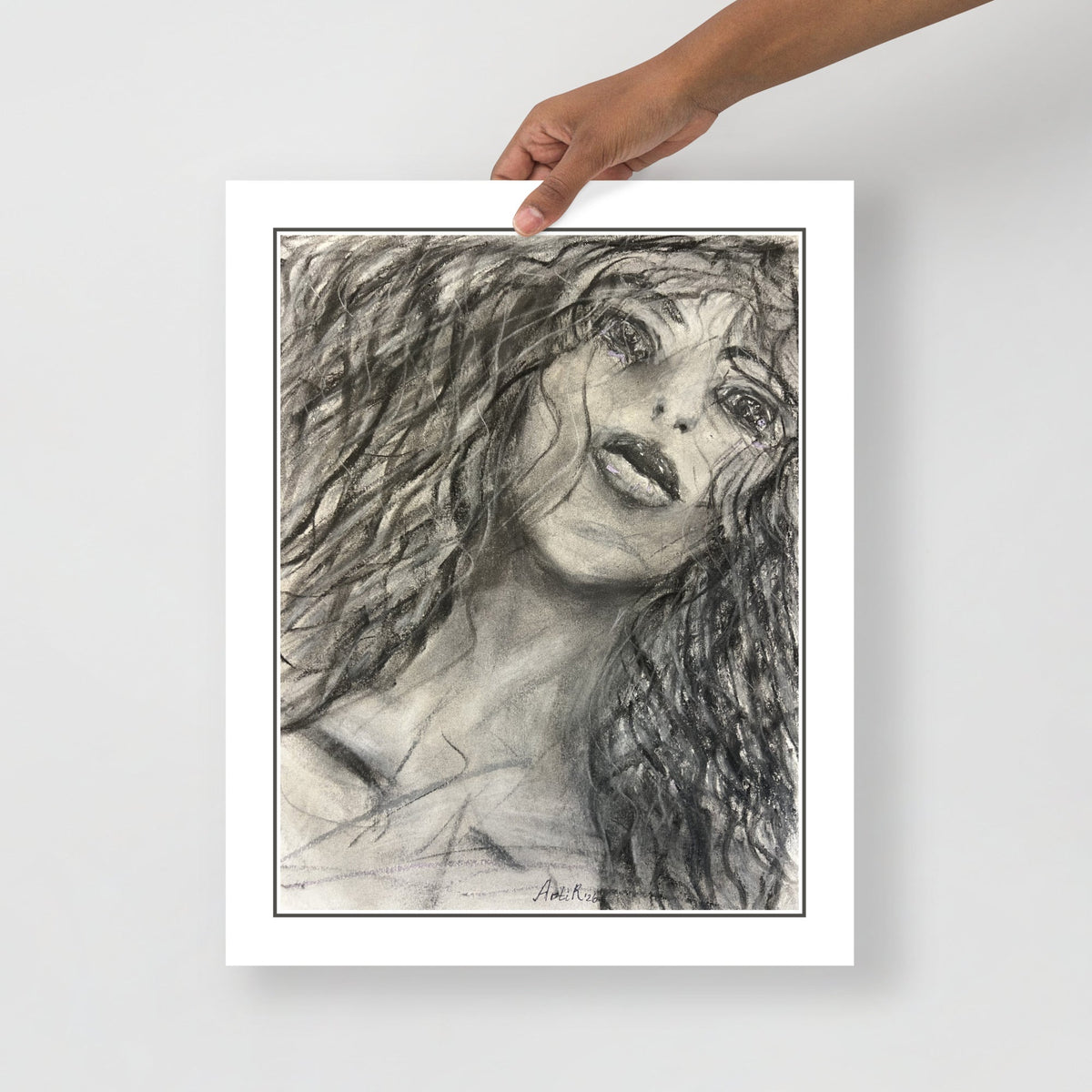 Hand holding the print — close-up