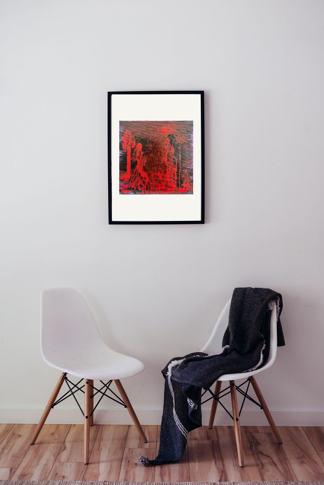 Kama Sutra in a black frame above two chairs — room preview