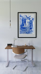 Among the Spirits framed over a desk in a bright room — room preview only